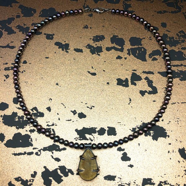 geo rutilated quartz claw pendant full